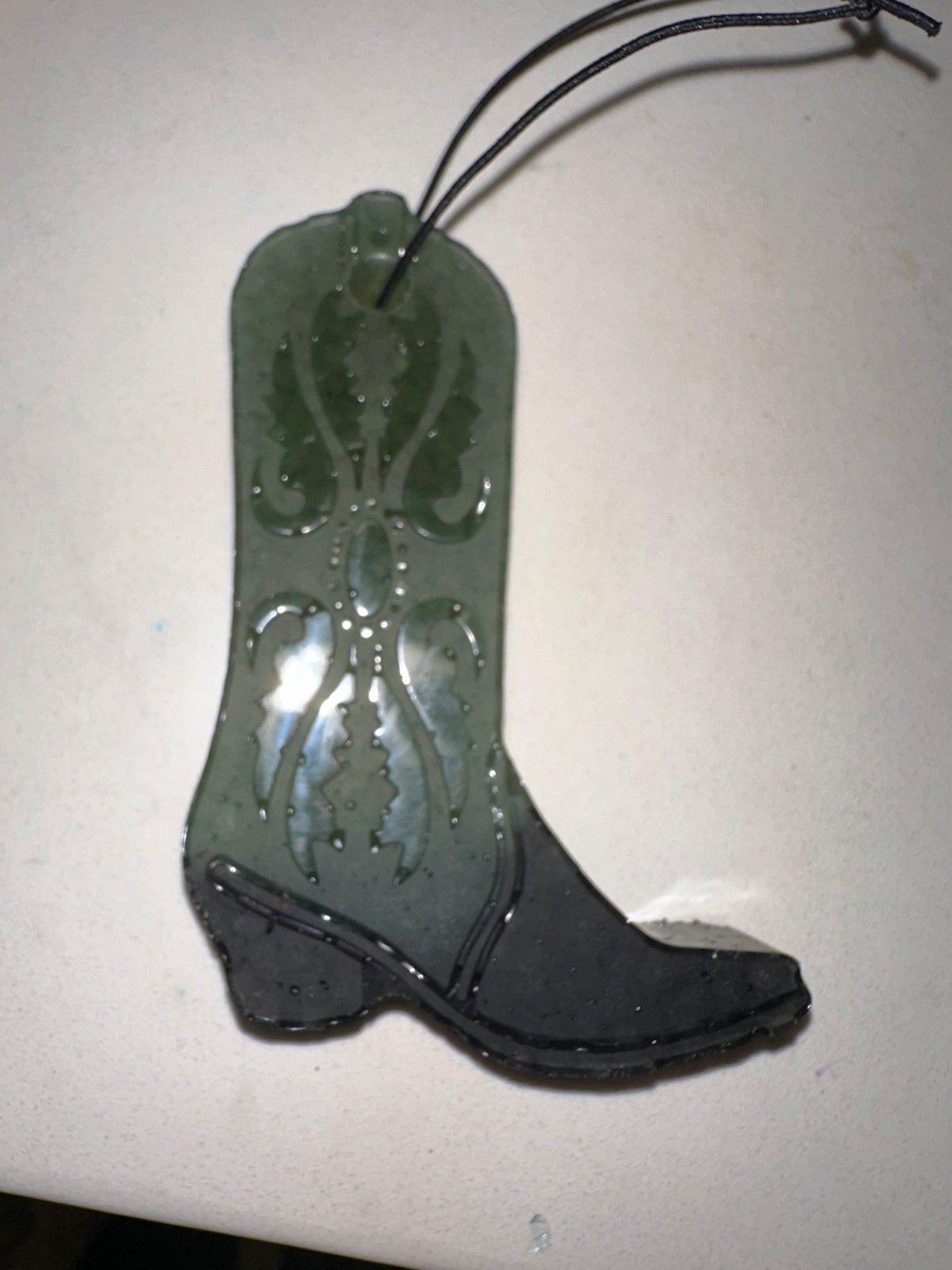 Green and black cowboy boot